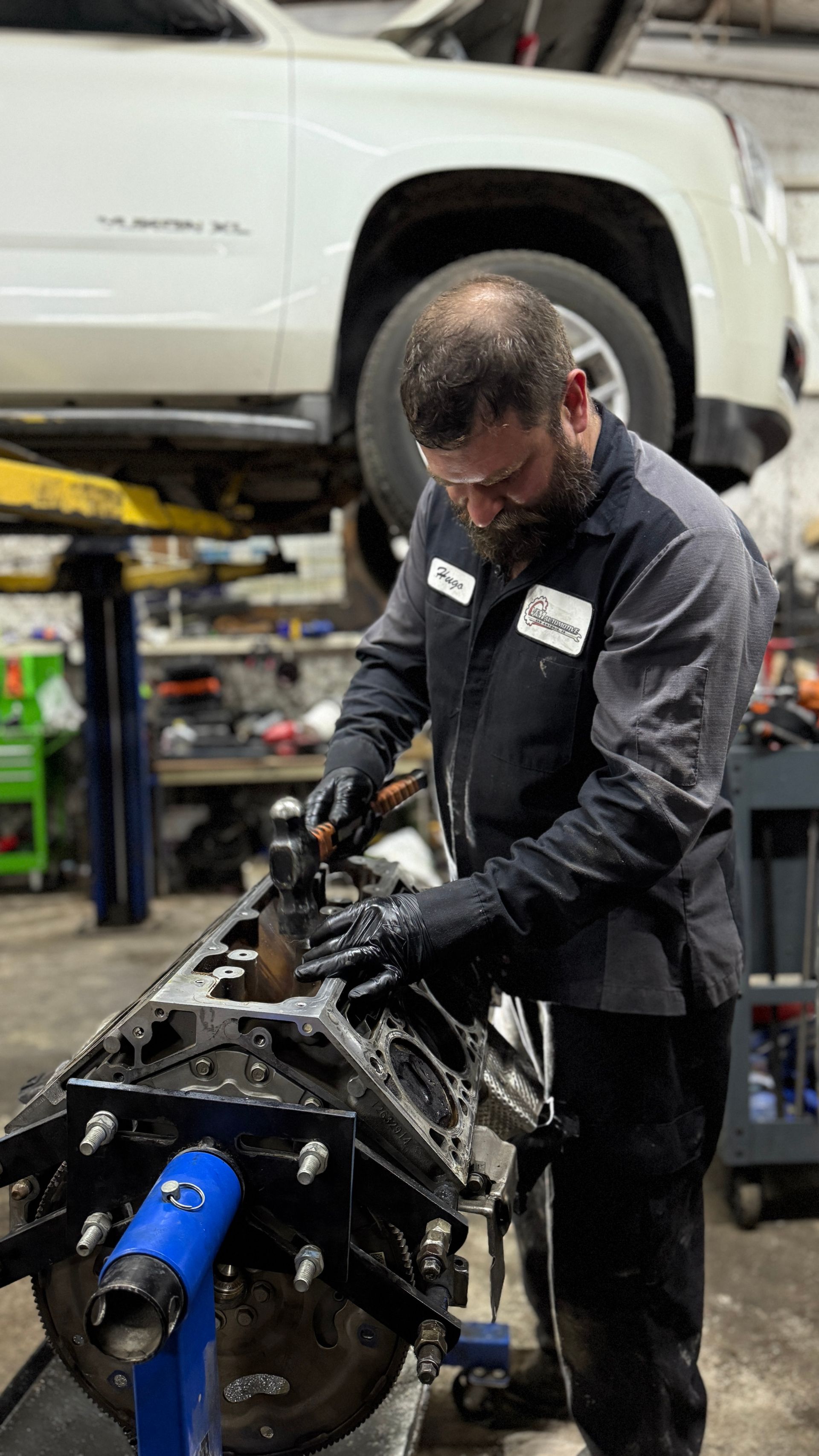 mechanic working on engine | VM Automotive