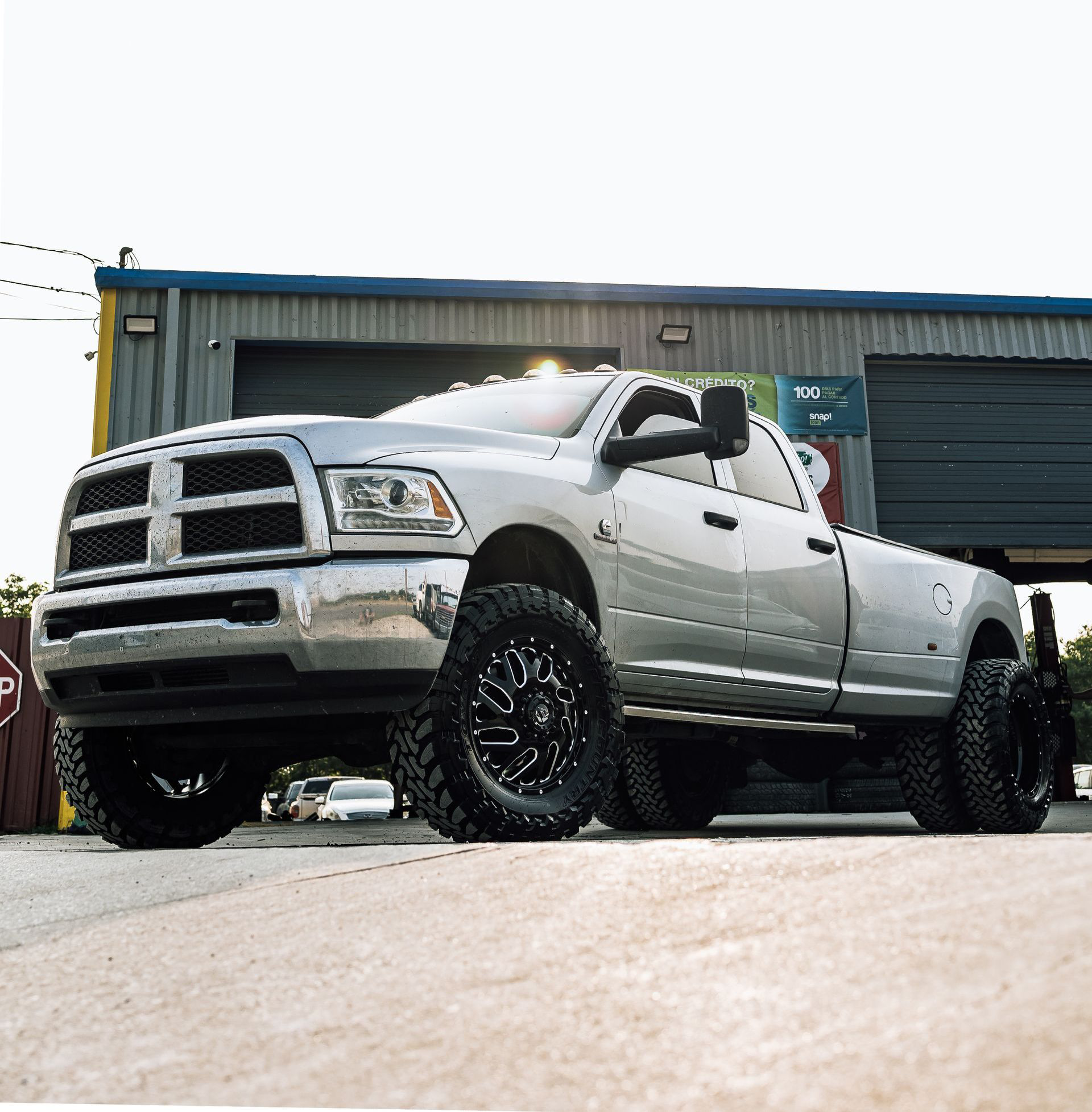 dark truck in front of shop | VM Automotive