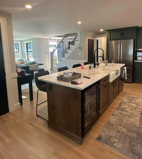 Damaged outdoor electrical outlet with exposed wires, mounted on white siding.