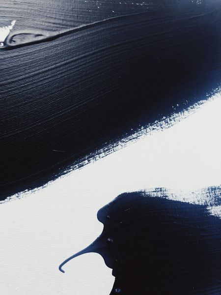 Abstract dark blue and white, possibly depicting a seabird or ocean waves.
