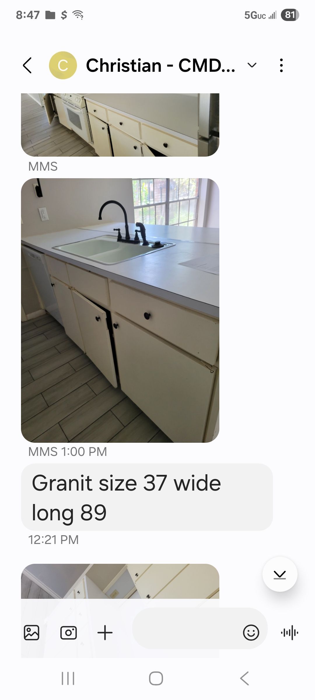 Kitchen cabinets with a granite countertop; text says 