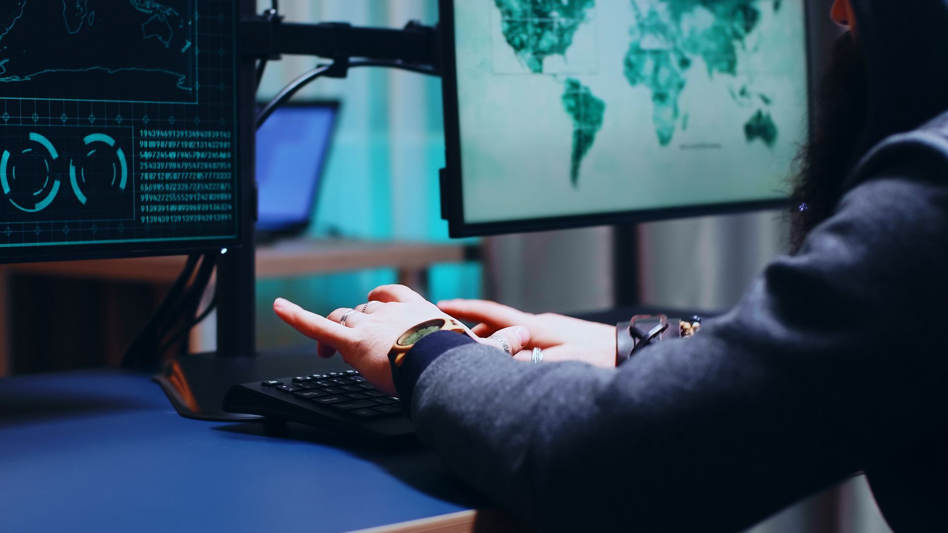 A person is sitting at a desk using a computer.