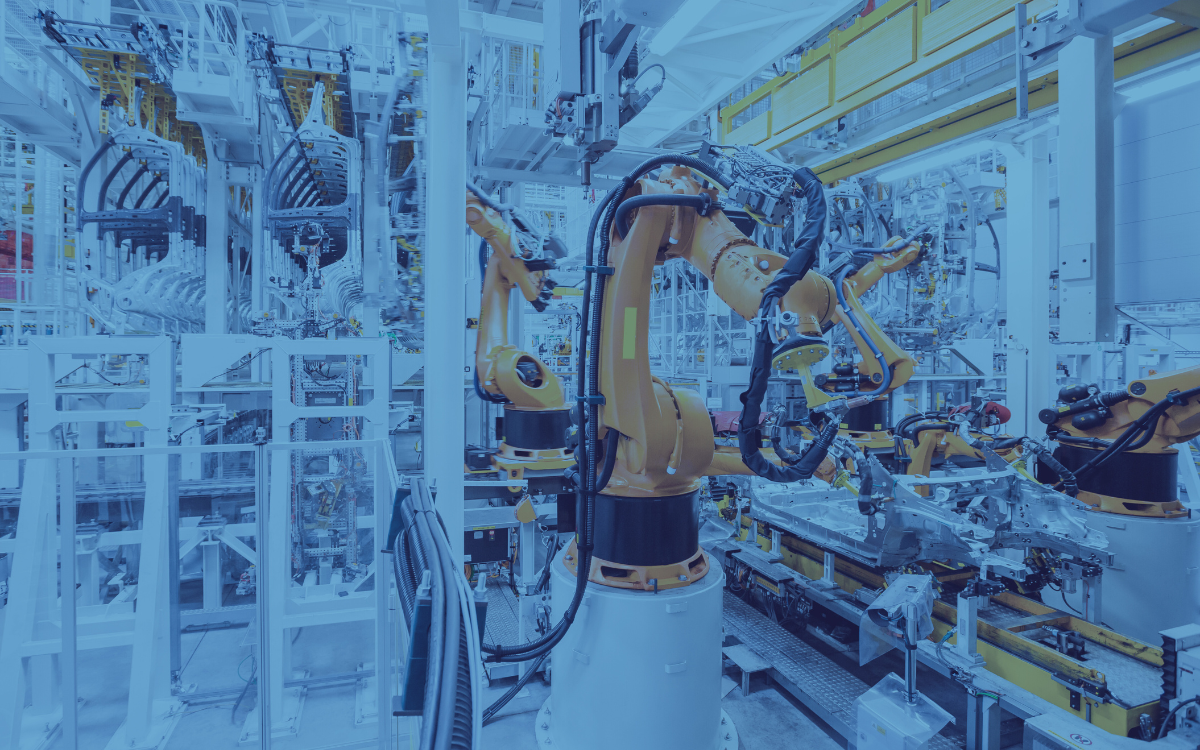 A robotic arm is working in a factory.
