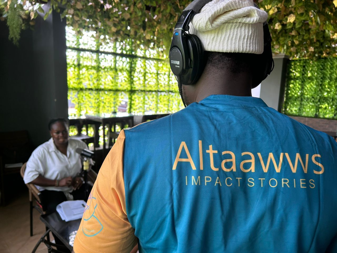 A crew member in headphones and wearing 