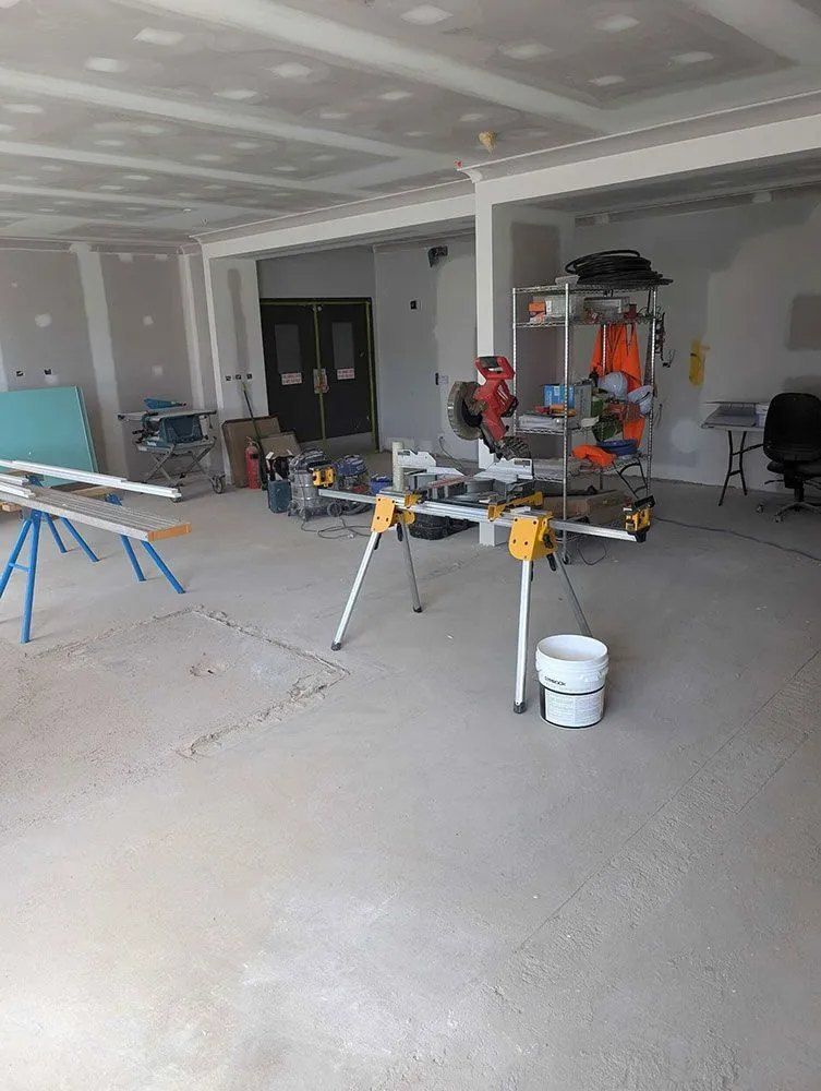 A Large Room With a Lot of Tools and a Bucket on the Floor — Chandolin Construction in Bathurst, NSW