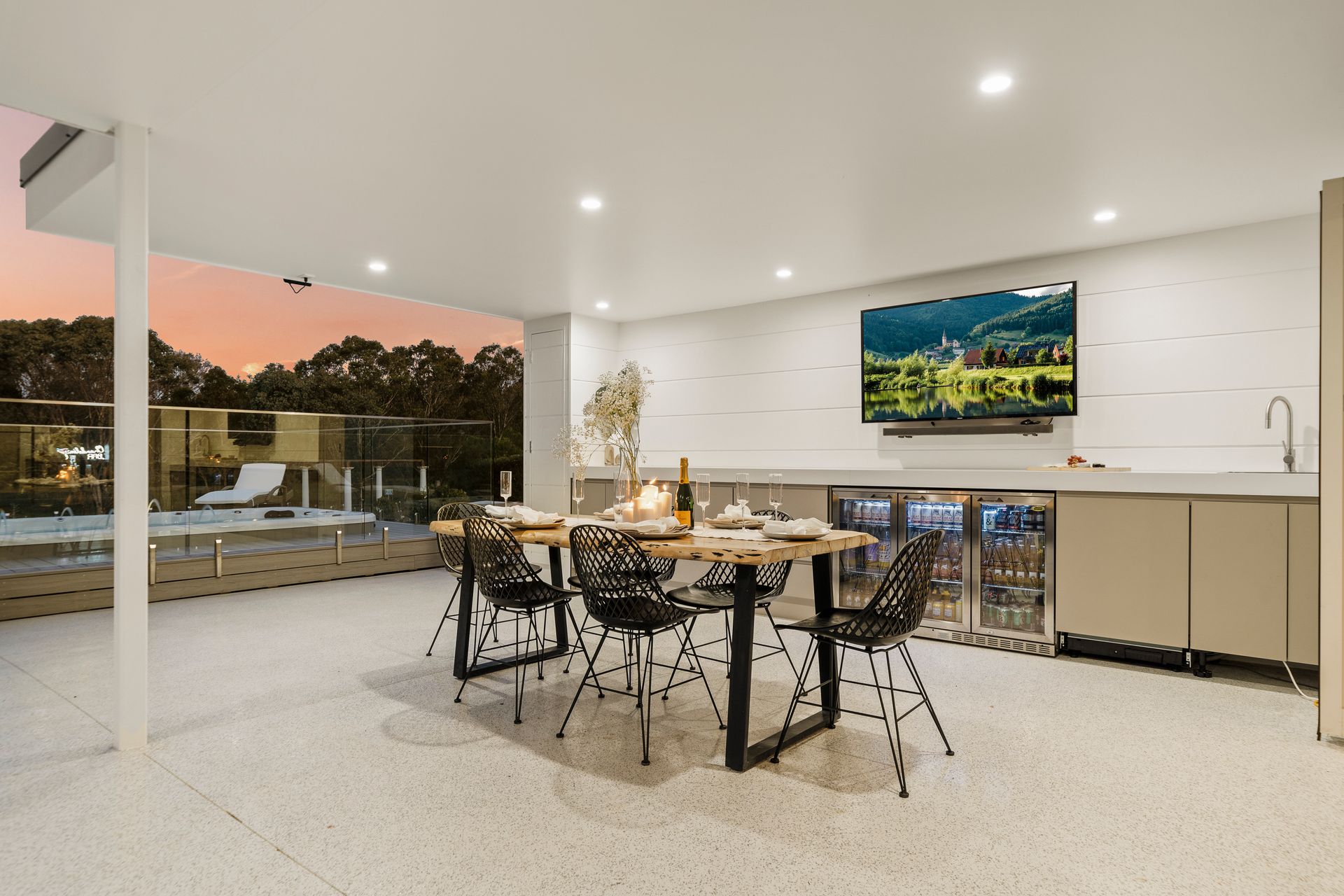 dinning room table with a sunsetting in the background — Chandolin Construction in Bathurst, NSW