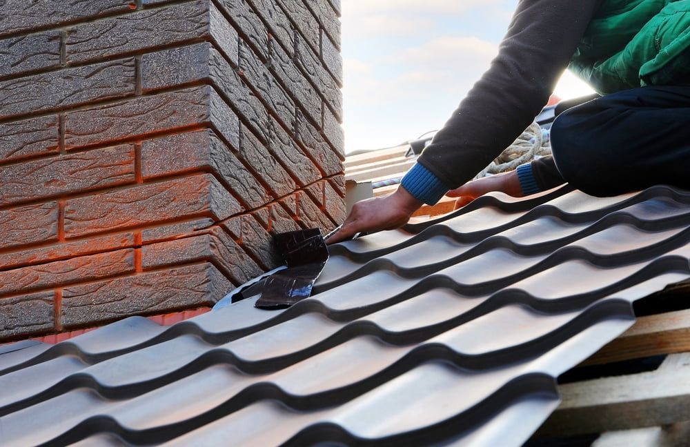 A Man Fixing A Roof — Burton Group In Ciccone, NT