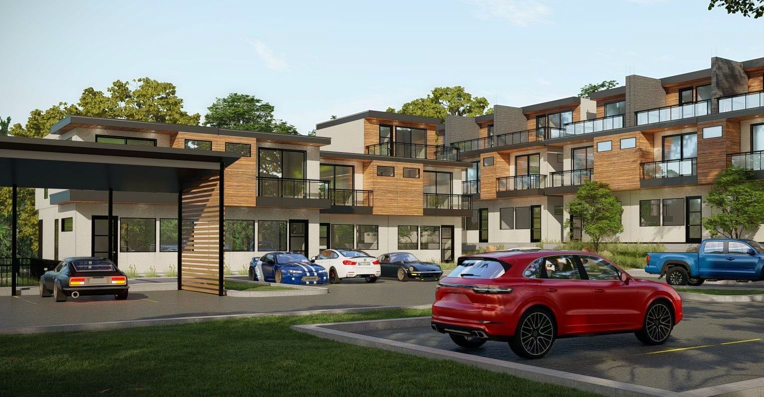 A red car is parked in front of a building.