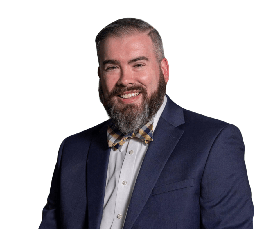 A man with a beard is wearing a suit and bow tie.