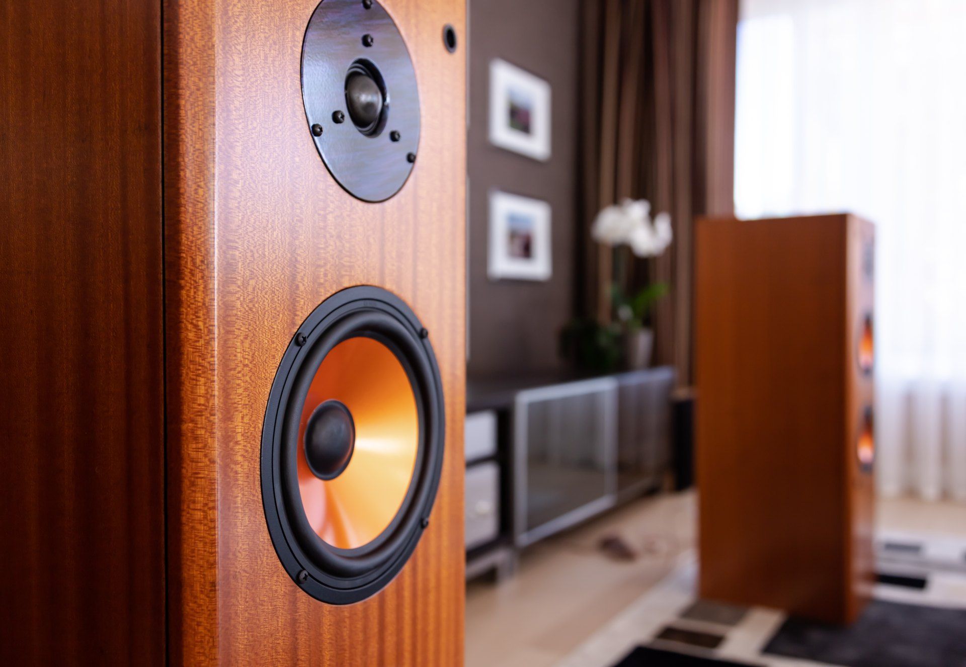 A close up of a speaker in a living room.