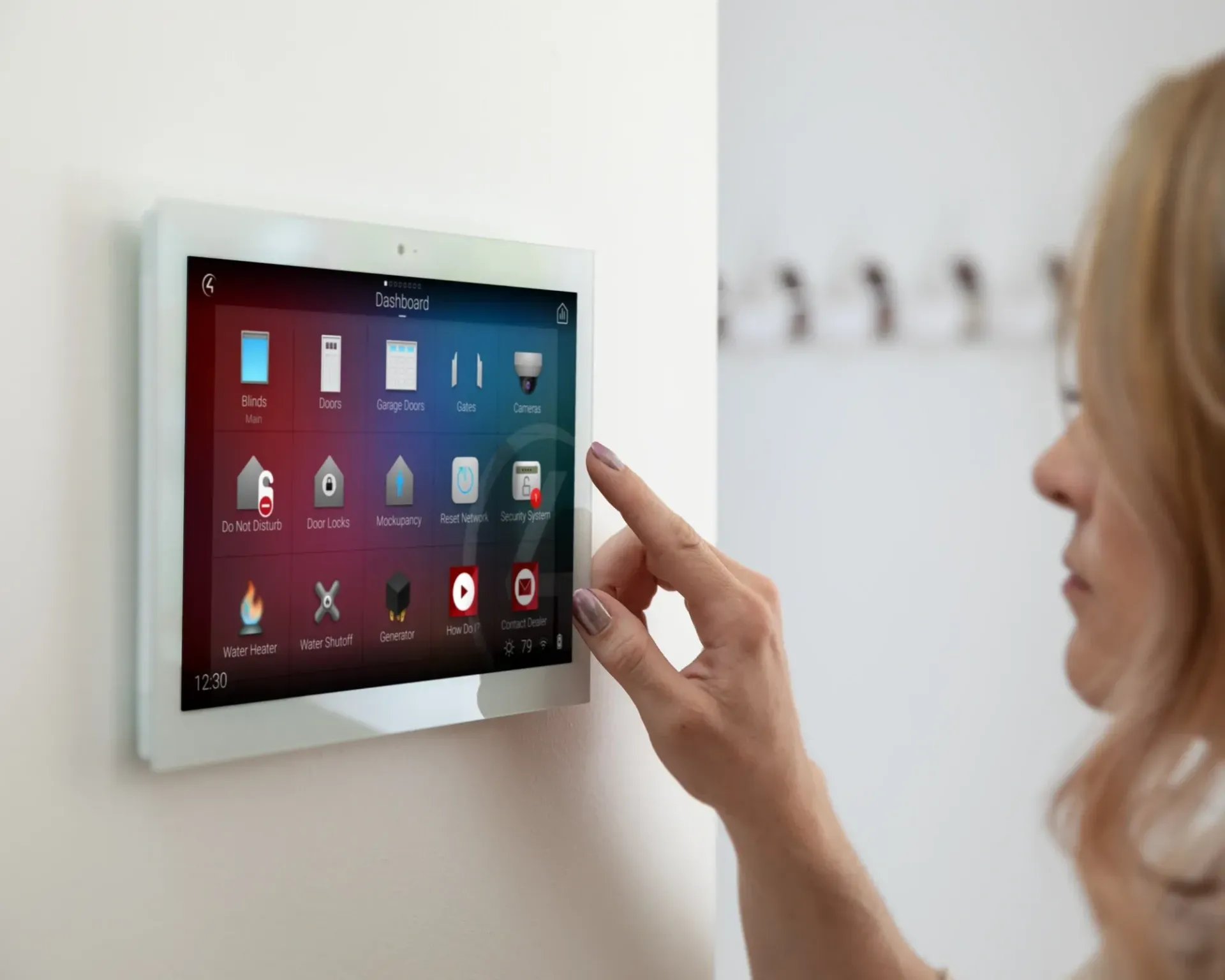 A woman is pressing a button on a smart device.
