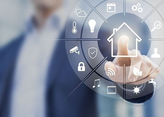 A man is pressing a button with a house on it.