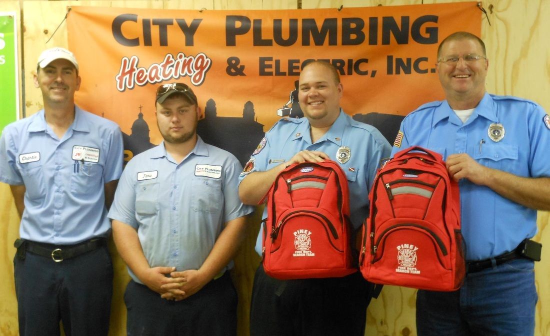 A group of men standing in front of a city plumbing sign