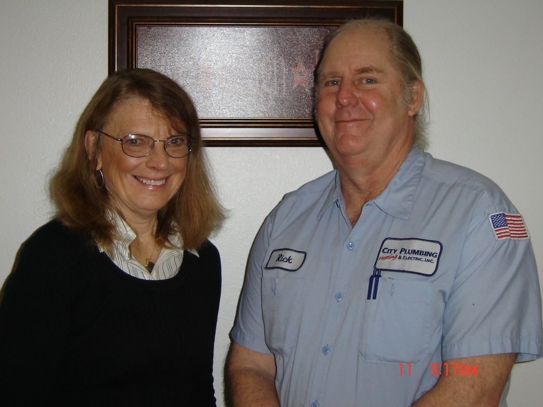 A man and a woman are posing for a picture together