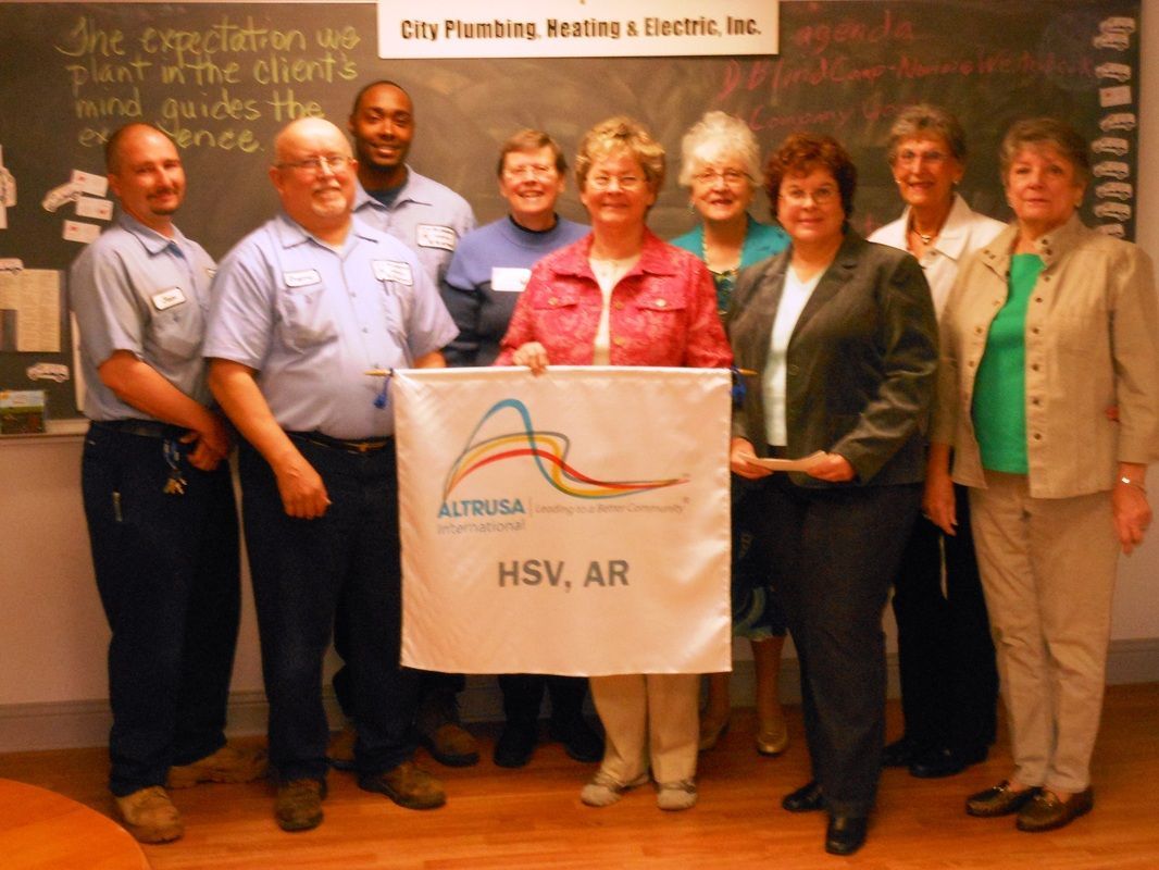 A group of people holding a banner that says hsv ar