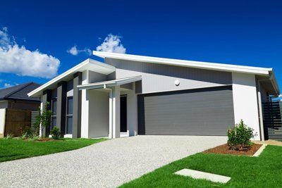white home with grey garage