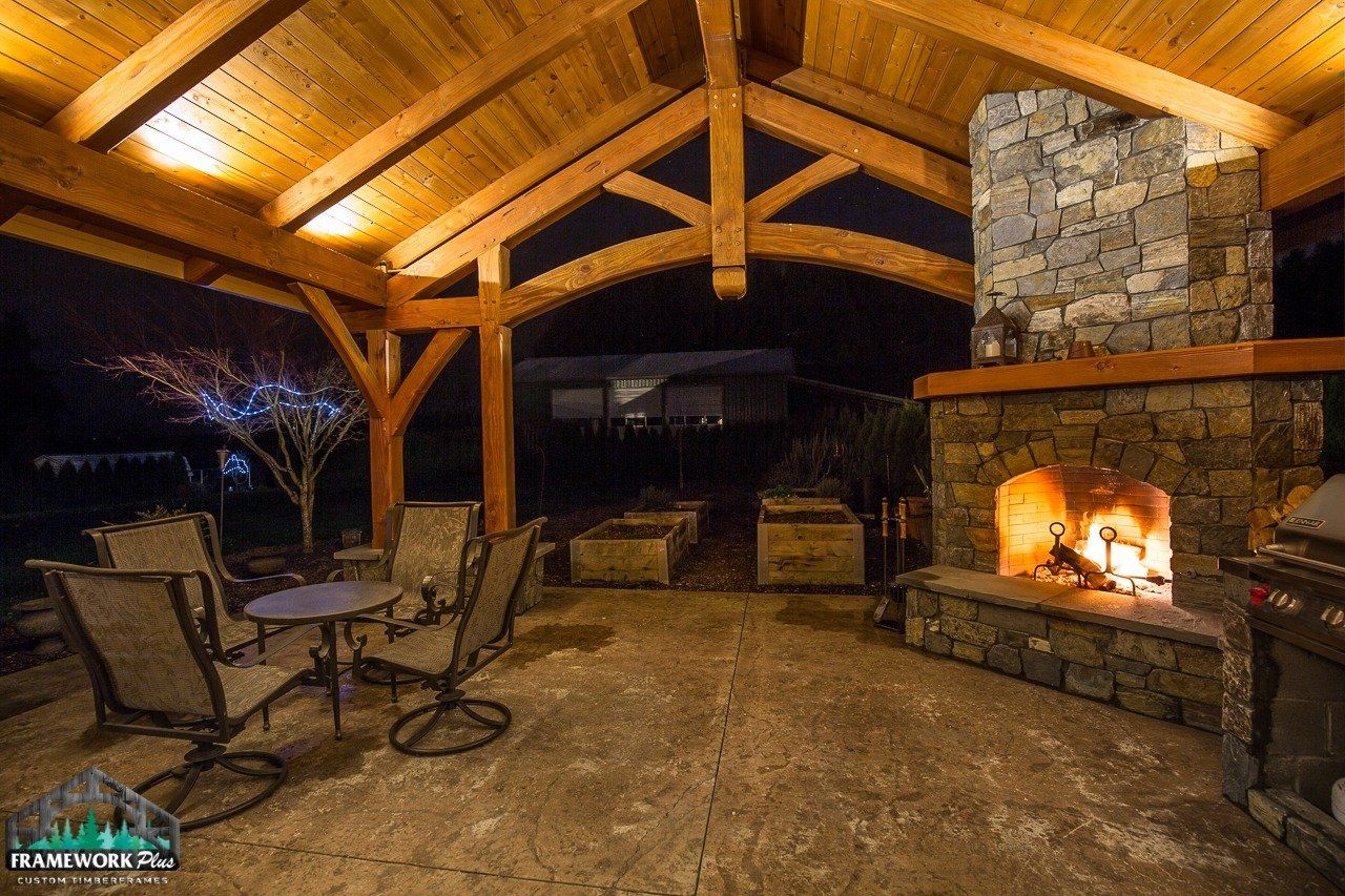 There is a fireplace in the middle of the patio.
