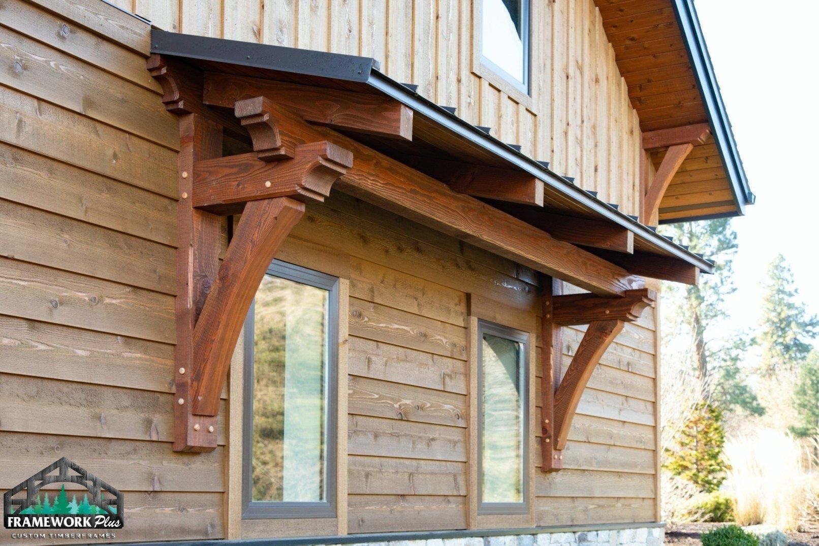 A wooden building with a wooden awning over a window