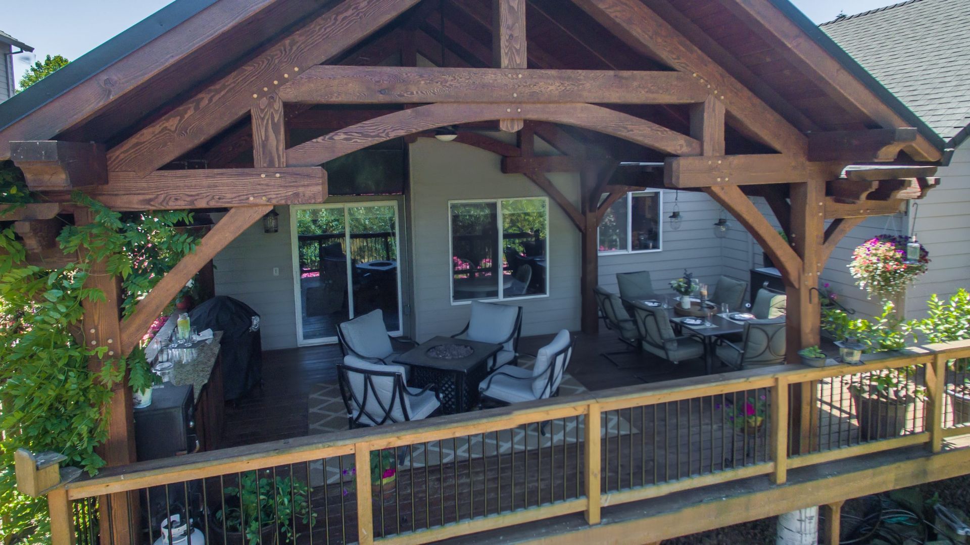 An aerial view of a house with a large wooden deck.