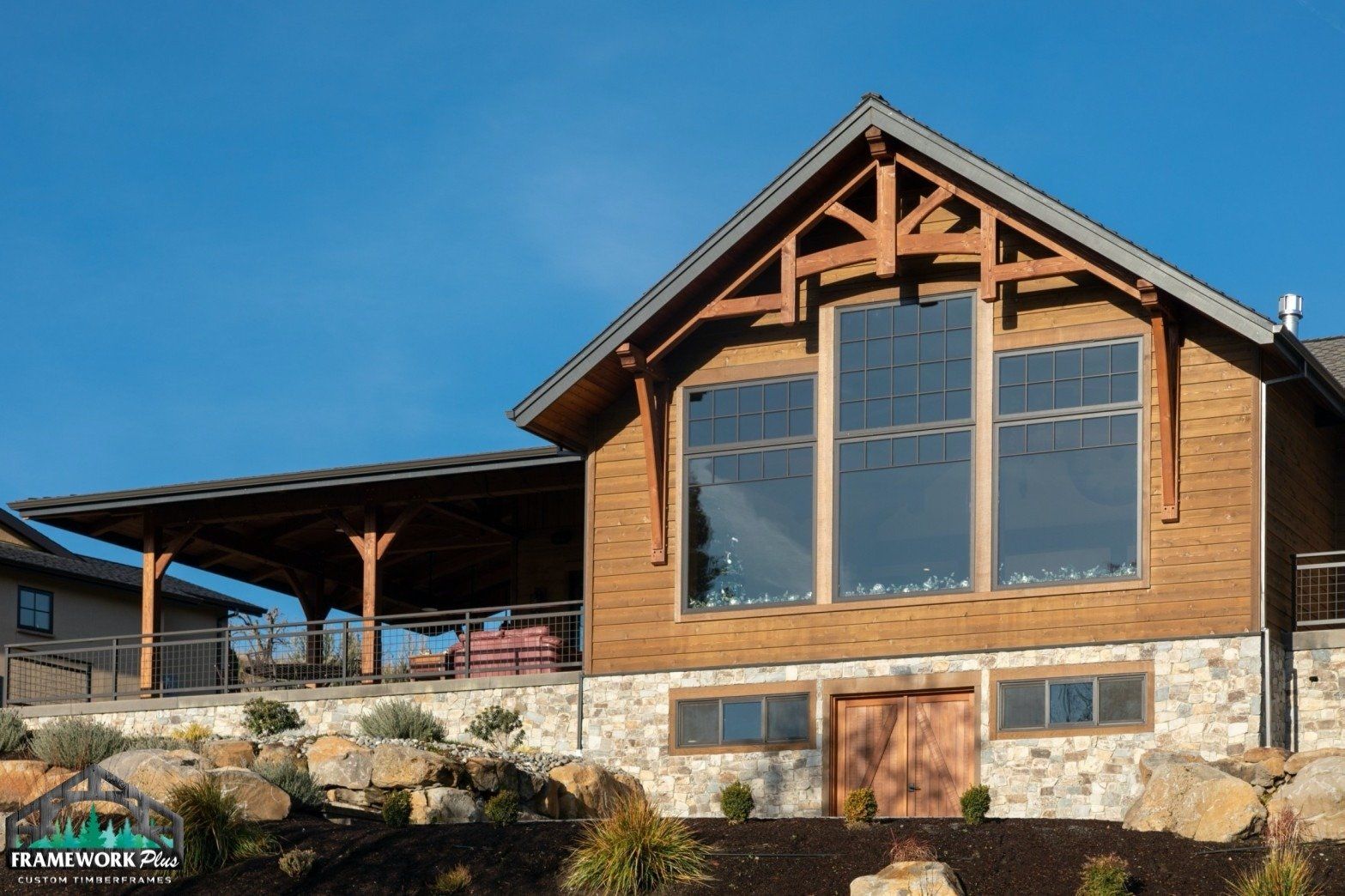 A large wooden house with a lot of windows