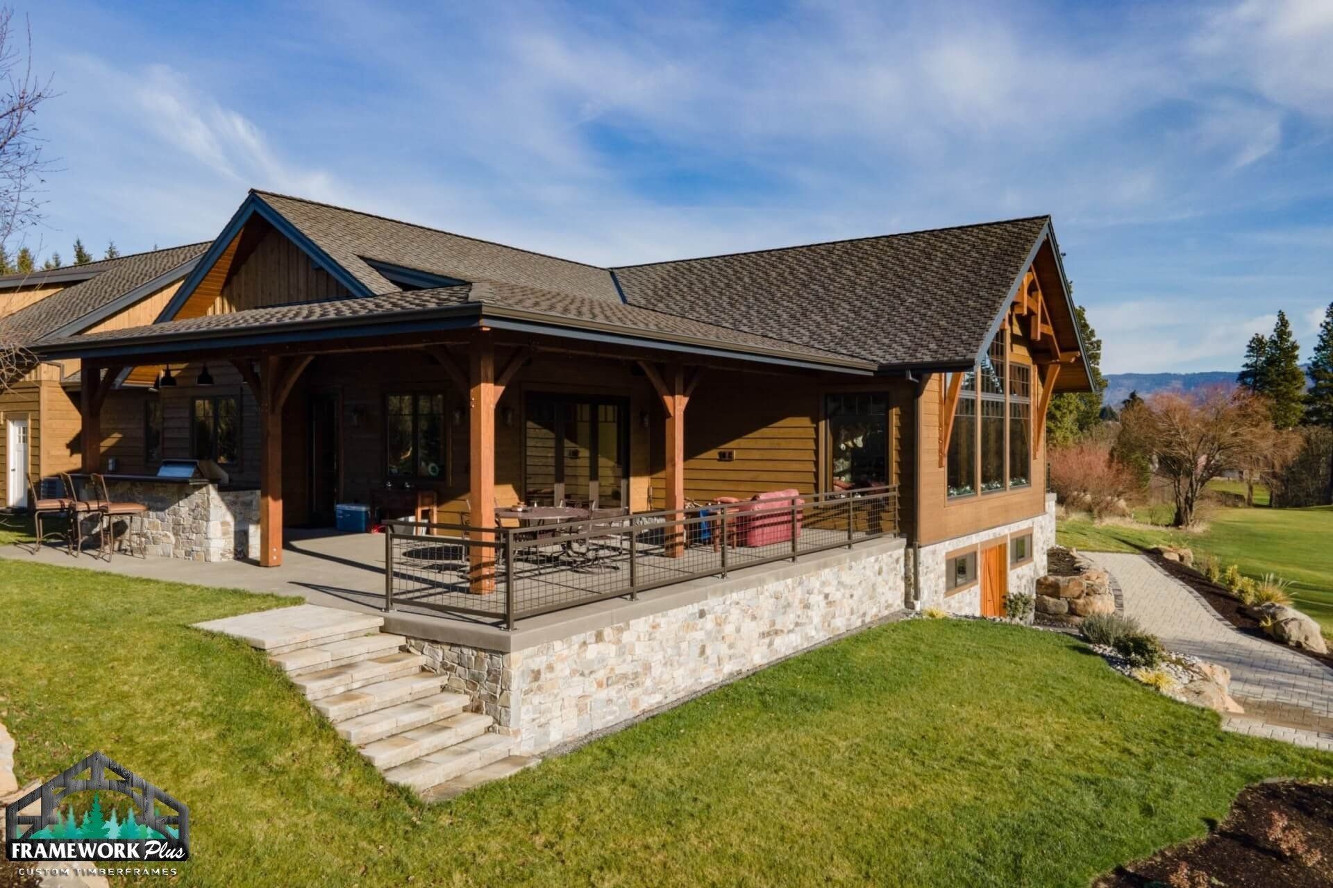 A large house with a large porch and stairs leading up to it.