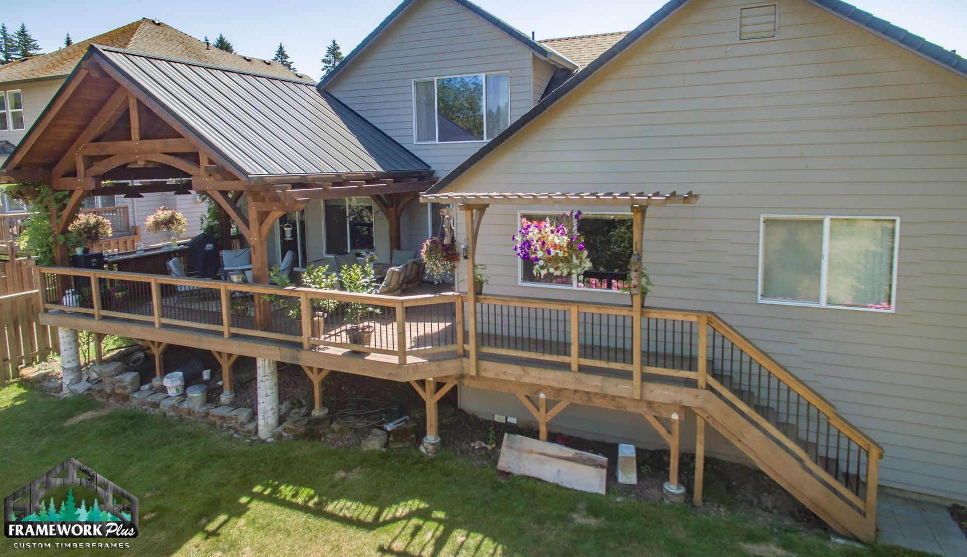 An aerial view of a house with a large wooden deck