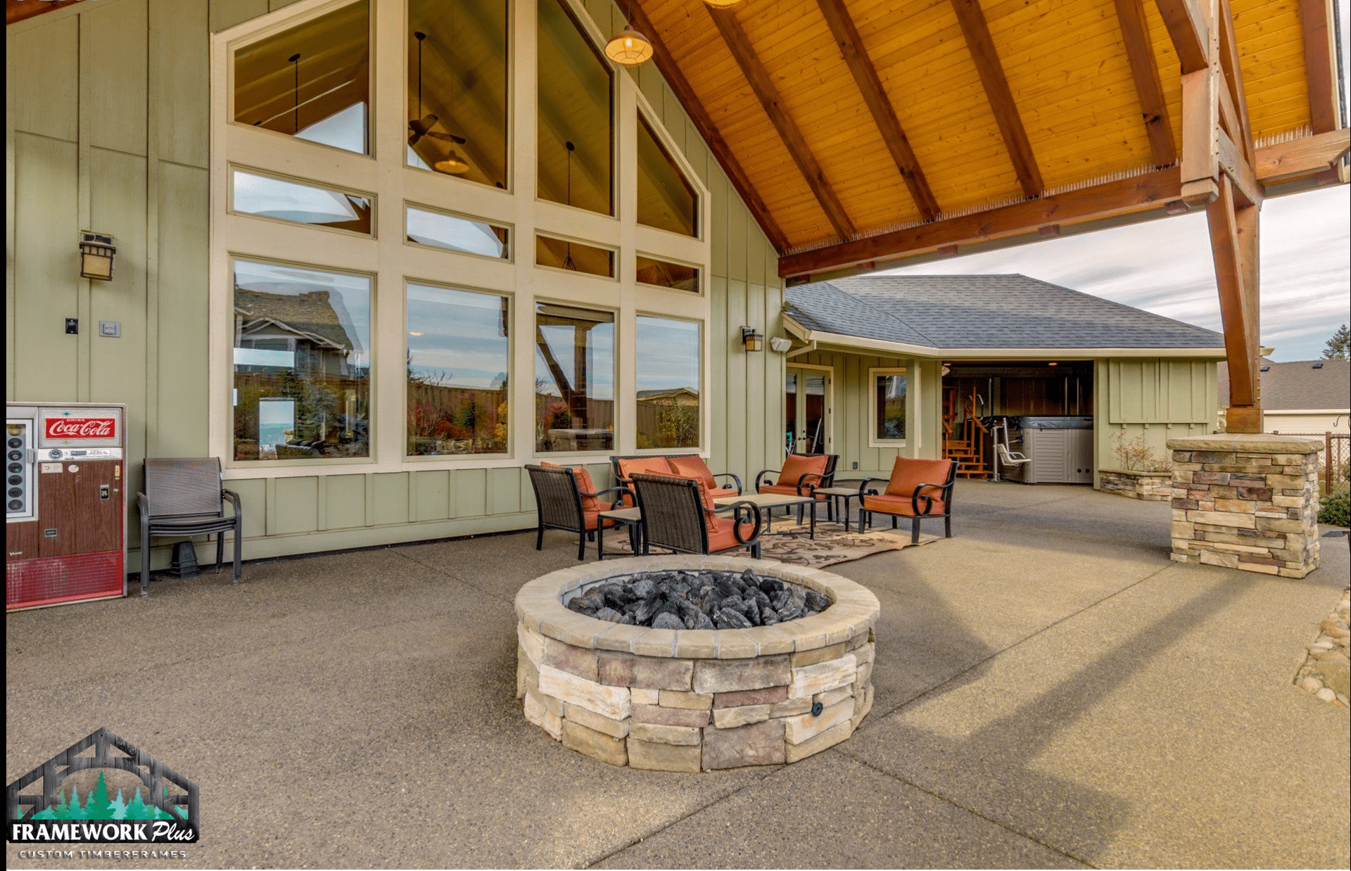 A large building with a fire pit in front of it