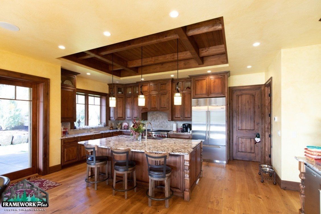 A kitchen with stainless steel appliances and wooden cabinets