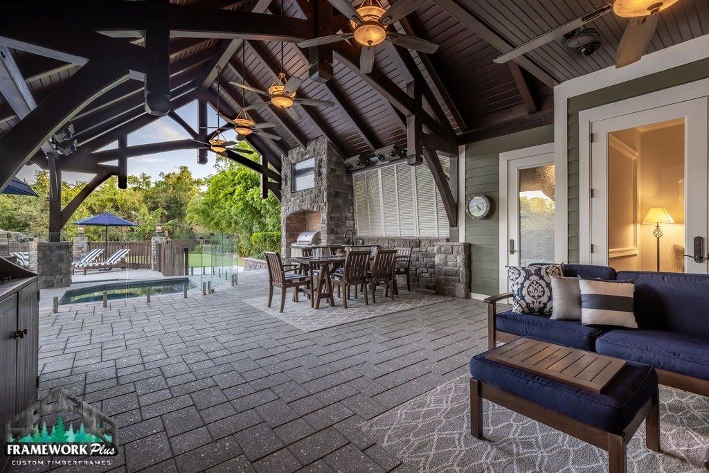 A living room with a blue couch and a ceiling fan