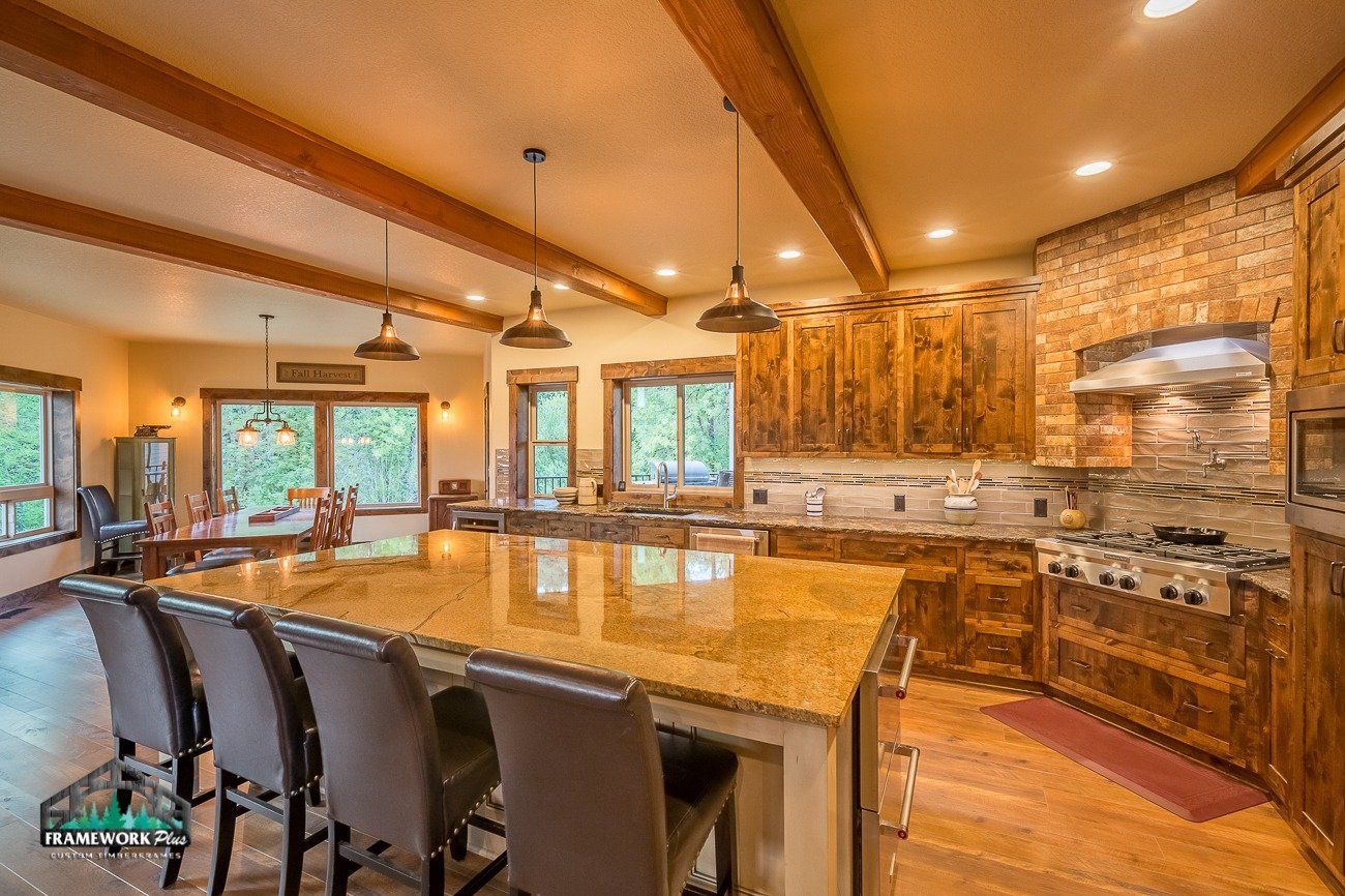 A large kitchen with a large island and a stove.