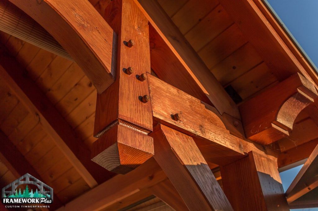 A close up of a wooden structure with a blue sky in the background.