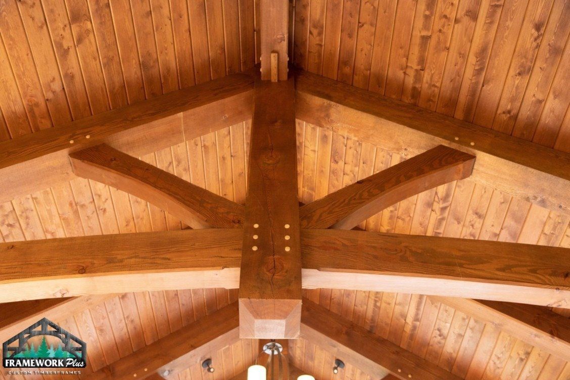 A wooden ceiling with a vaulted ceiling and wooden beams.