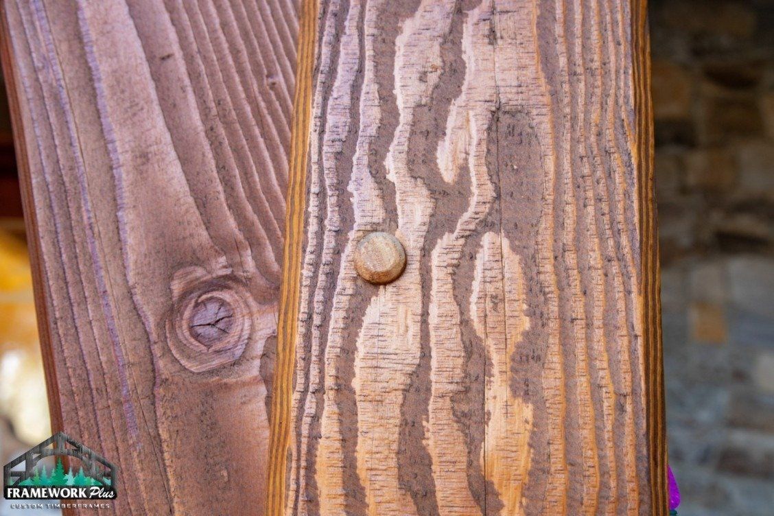 A close up of a piece of wood with a screw in it.