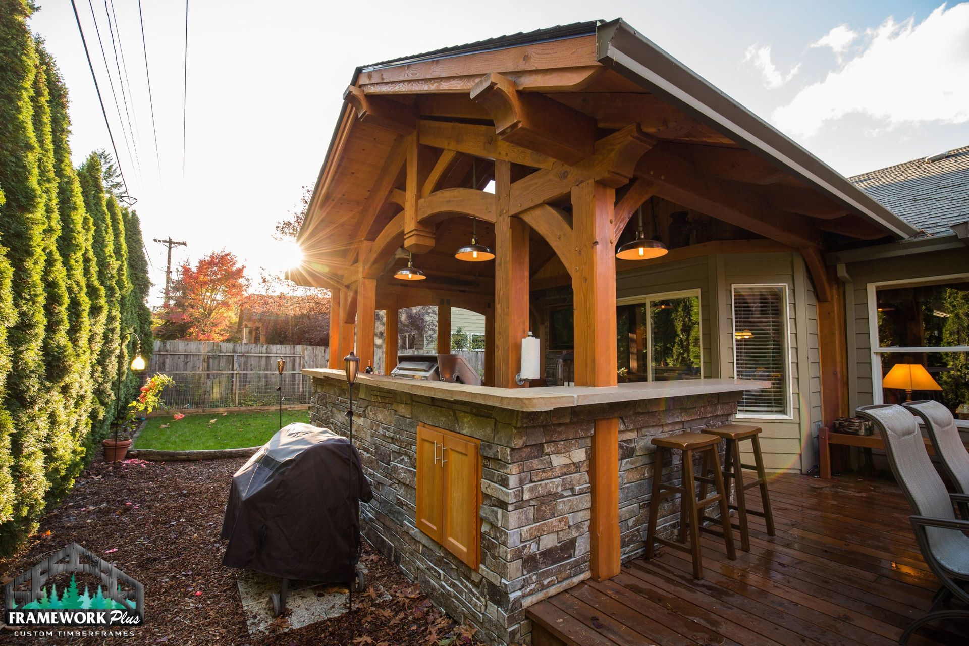 A house with a wooden roof and a stone bar