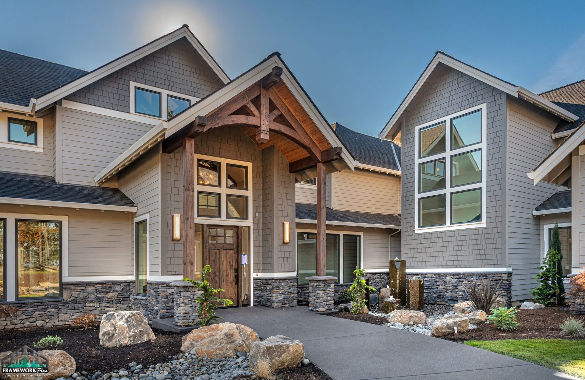 A large house with a lot of windows and a large driveway