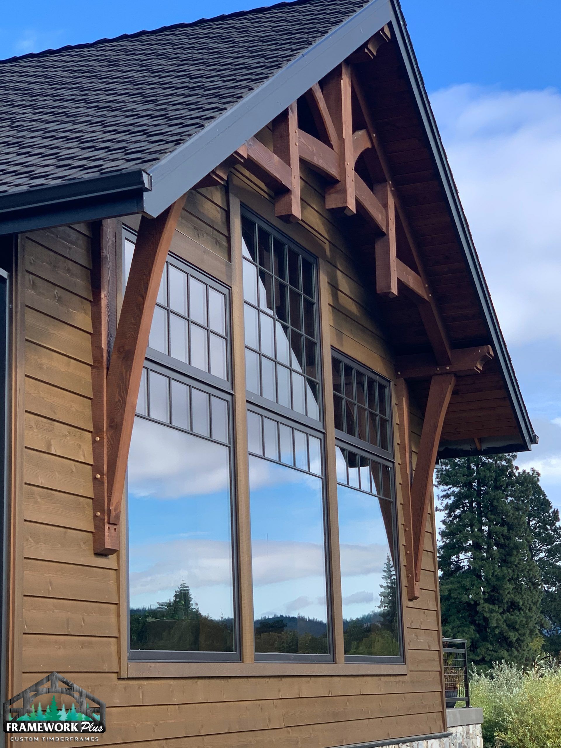 A house with a lot of windows and a roof