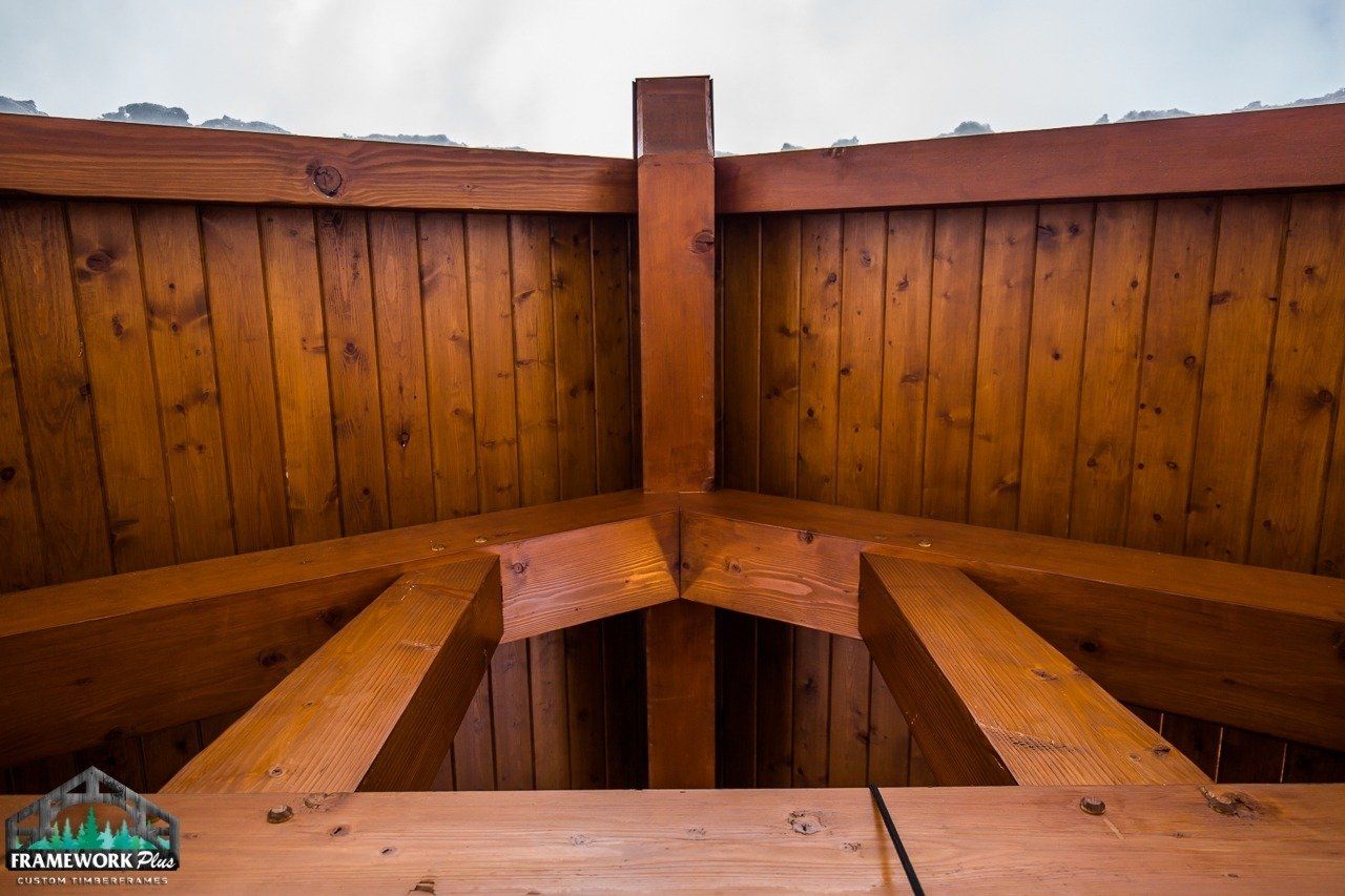 A close up of a wooden structure with a white sky in the background