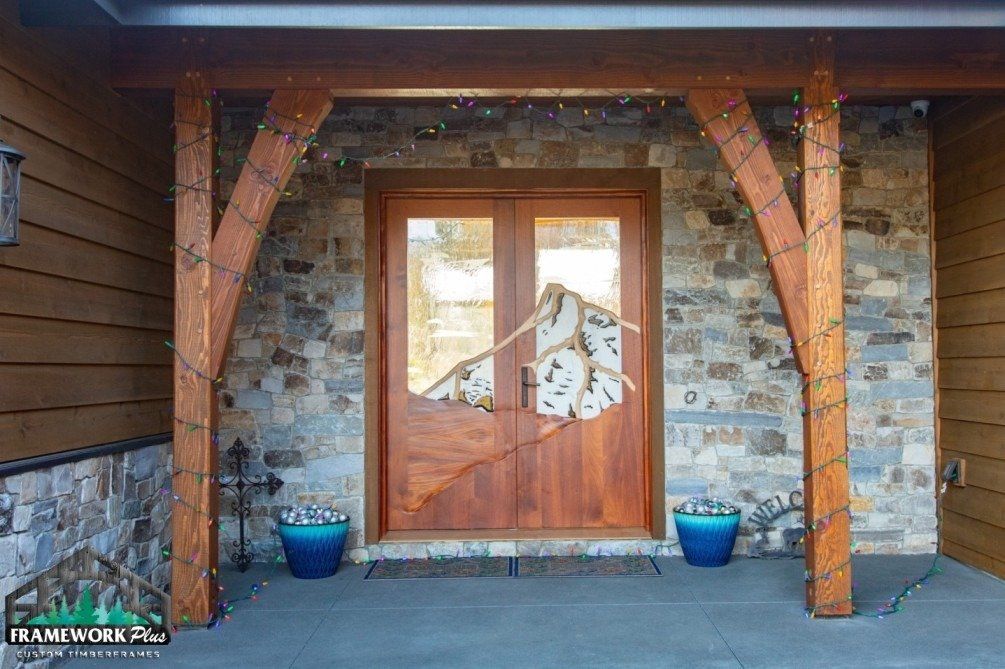 A wooden door with a stone wall behind it