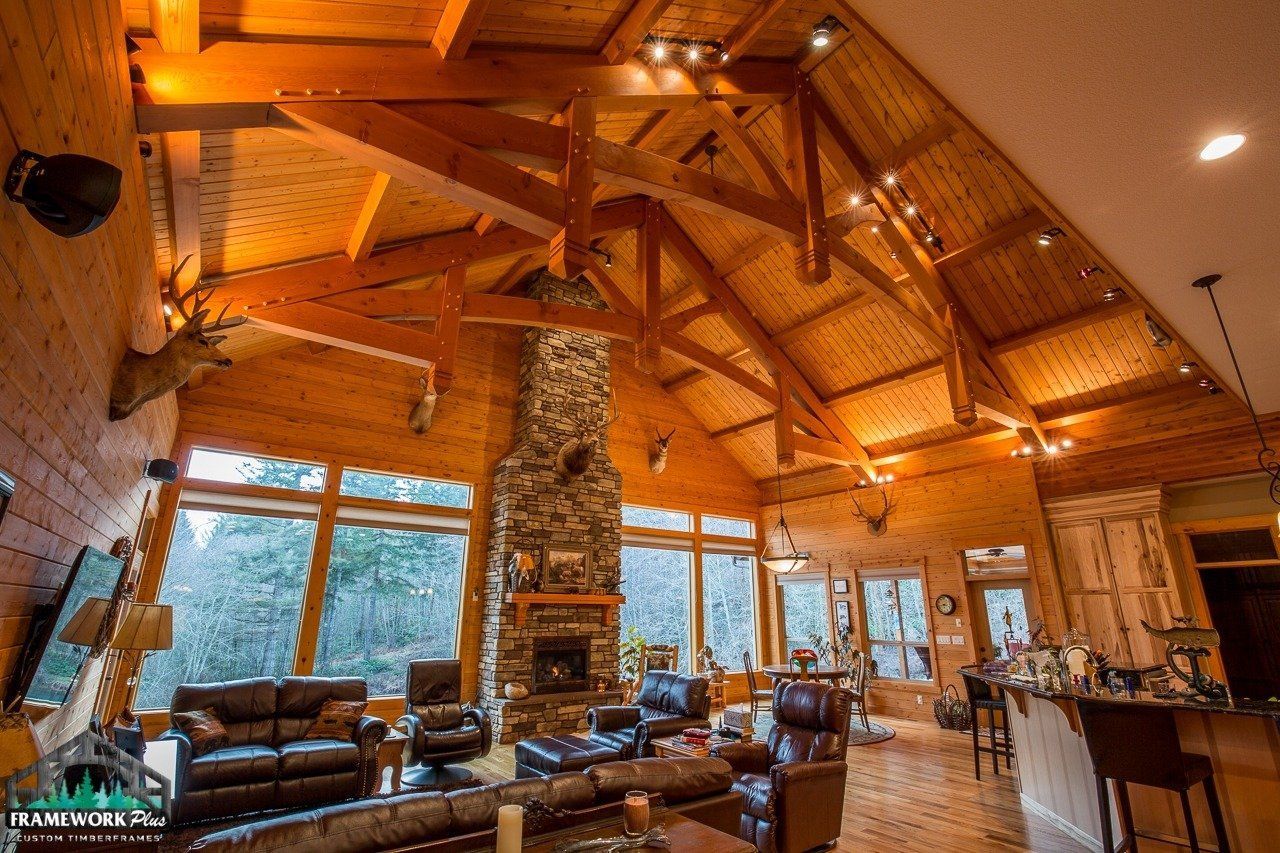 A large wooden house with a vaulted ceiling and lots of windows