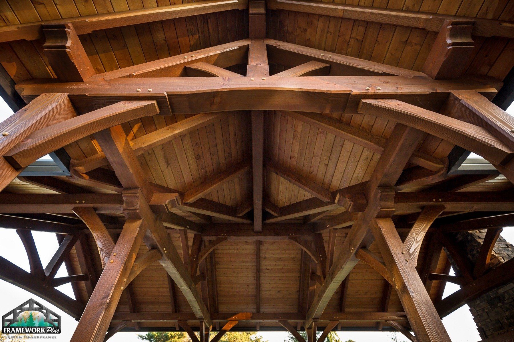 The inside of a wooden structure with a roof