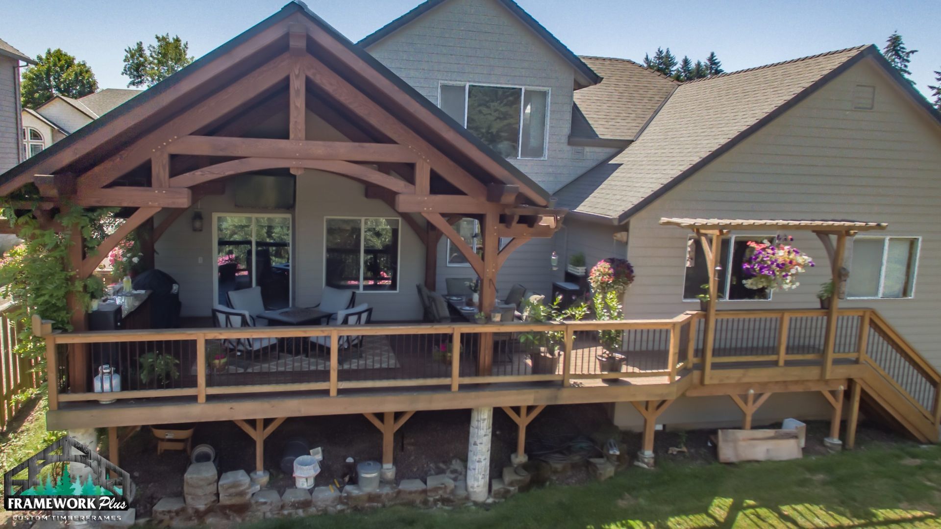 The back of a house with a large wooden deck