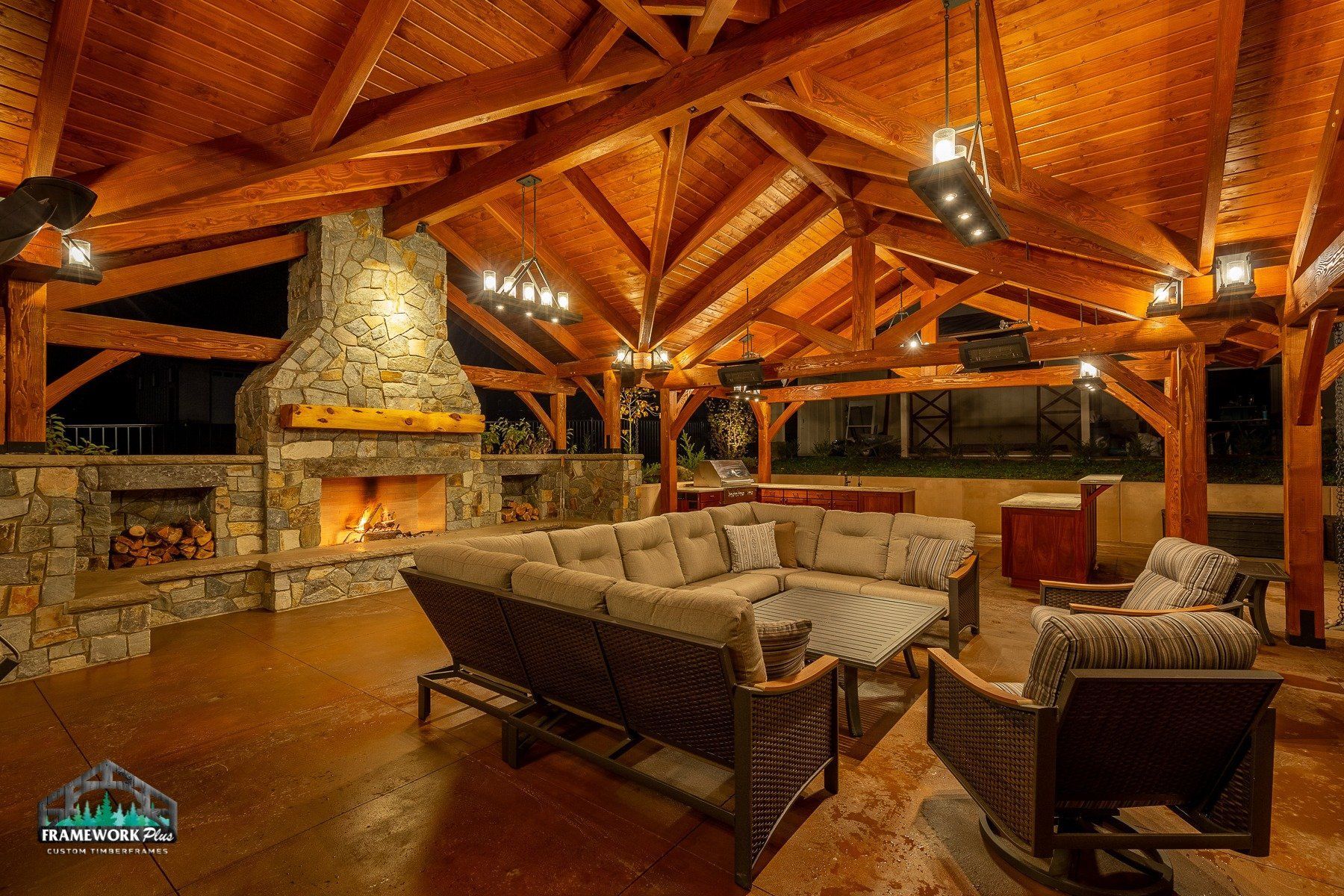 A living room with a couch , chairs , and a fireplace.