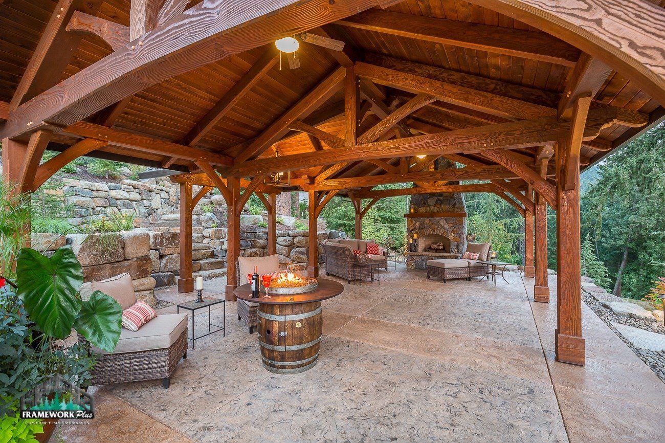 There is a fire pit in the middle of the pavilion.