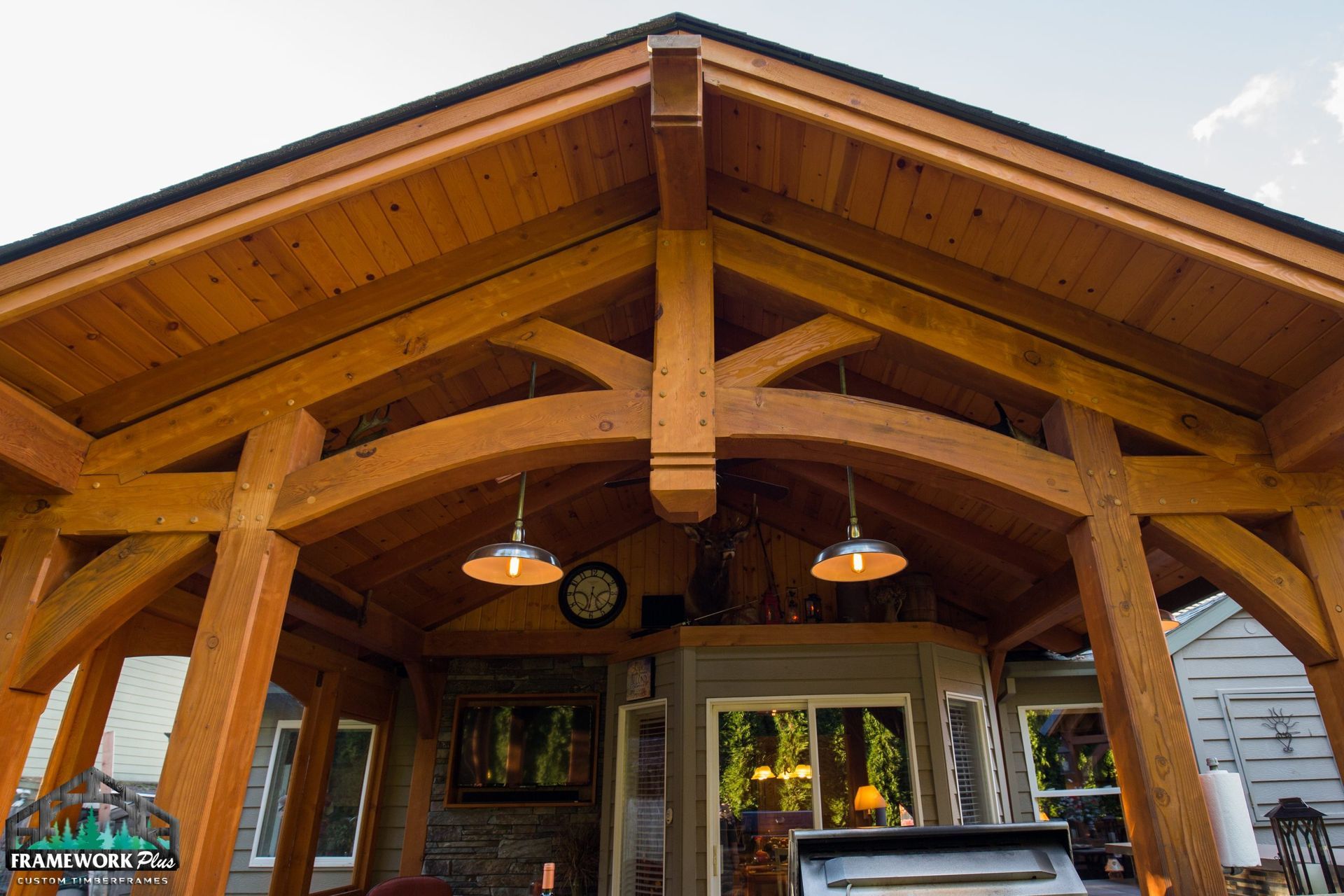 A wooden structure with a roof that looks like a house.