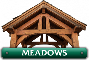 A green sign that says meadows on it