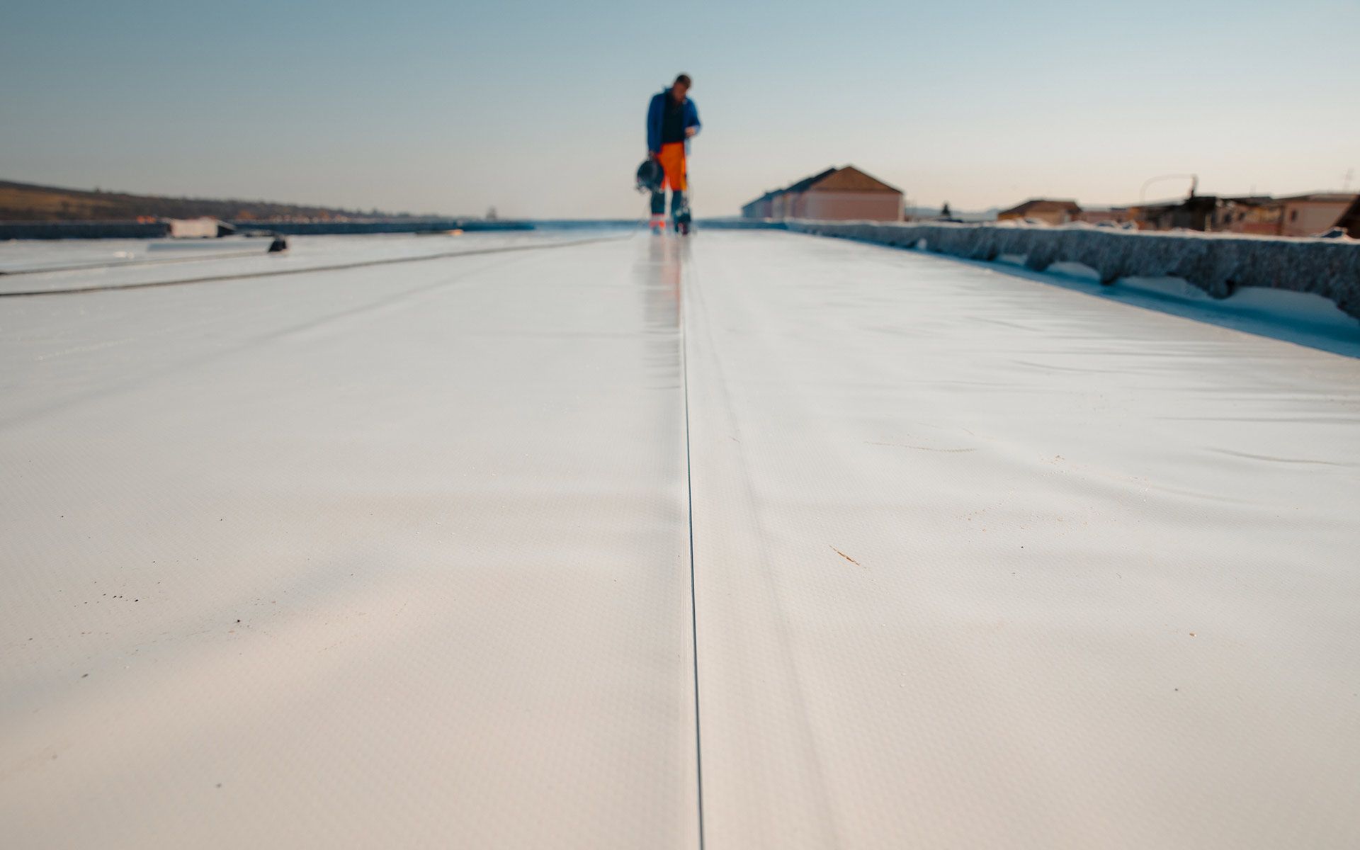 Man At Roof Working — Coal City, IL — Plattville Coatings
