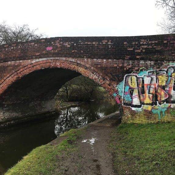 Graffiti removal from the sides of bridge wall