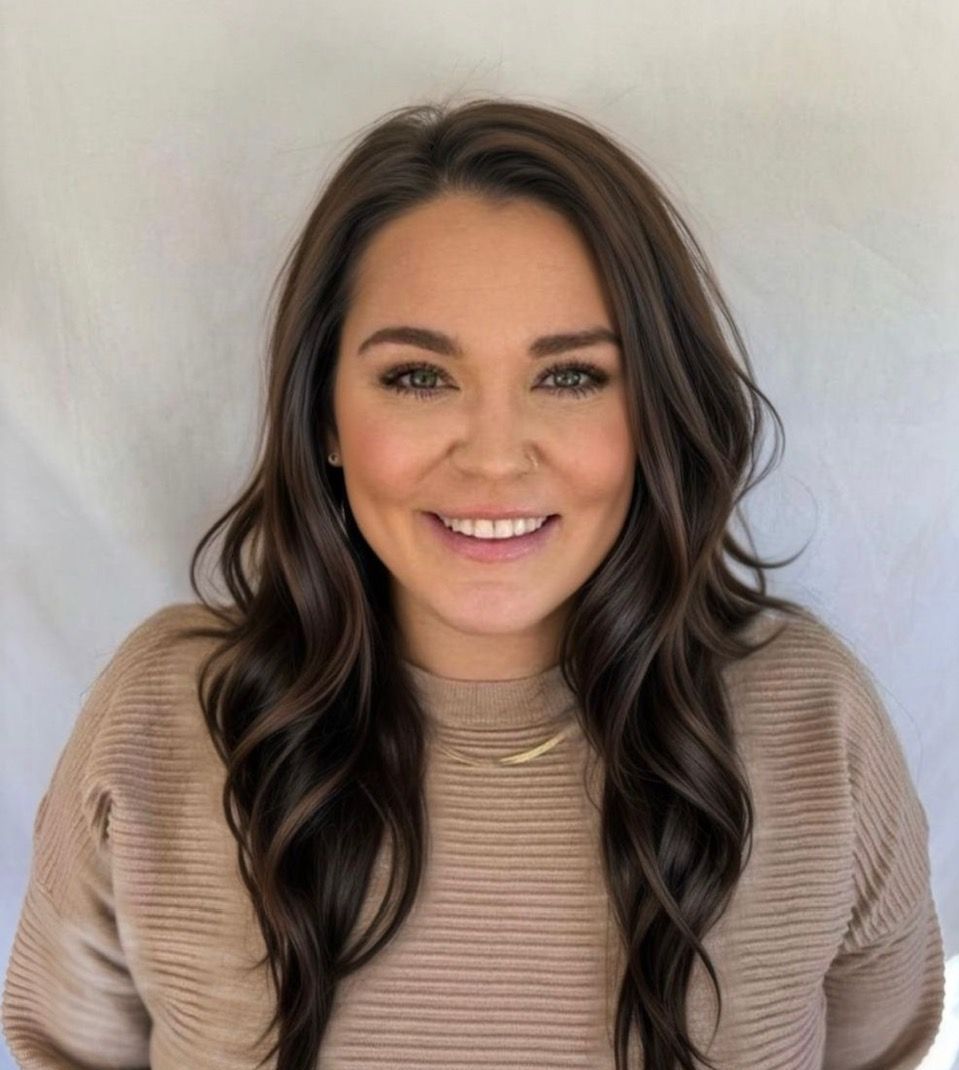 A woman with long black hair is smiling in a circle