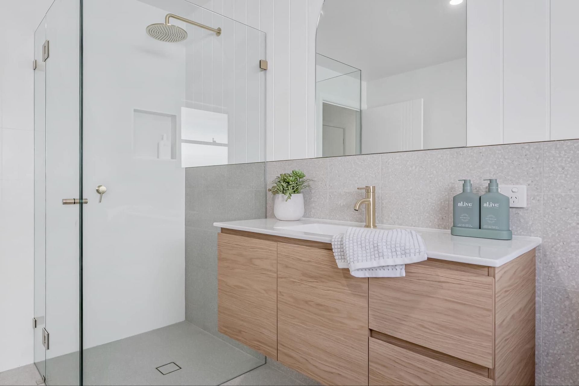 White Bathroom With Two Sinks, Toilet, Window, and Built-in Shelving — B & A Plumbing & Gas In Wauchope, NSW