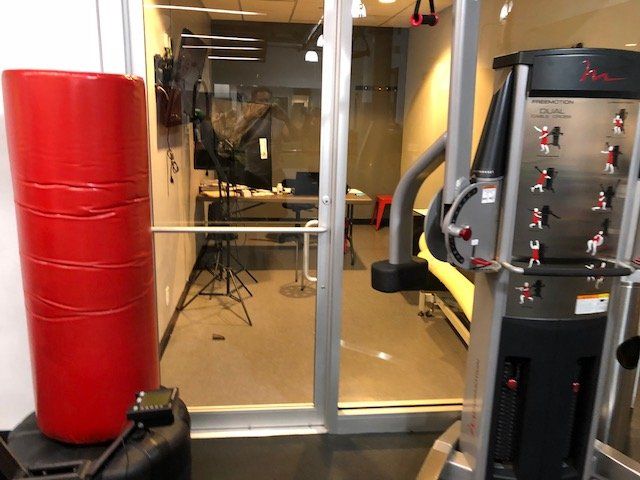 Strength training equipment and therapy setup in the Park Avenue clinic gym area.
